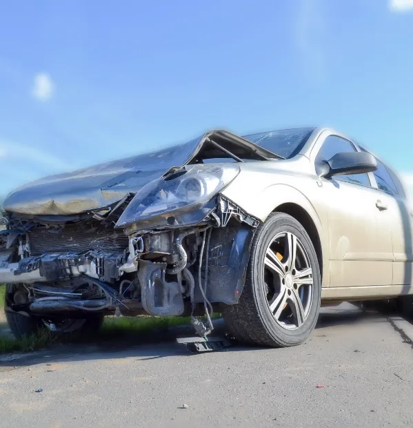 Front end of car crushed after an accident. If you’ve had your property damaged by a negligent driver, our car accident lawyers can help you.