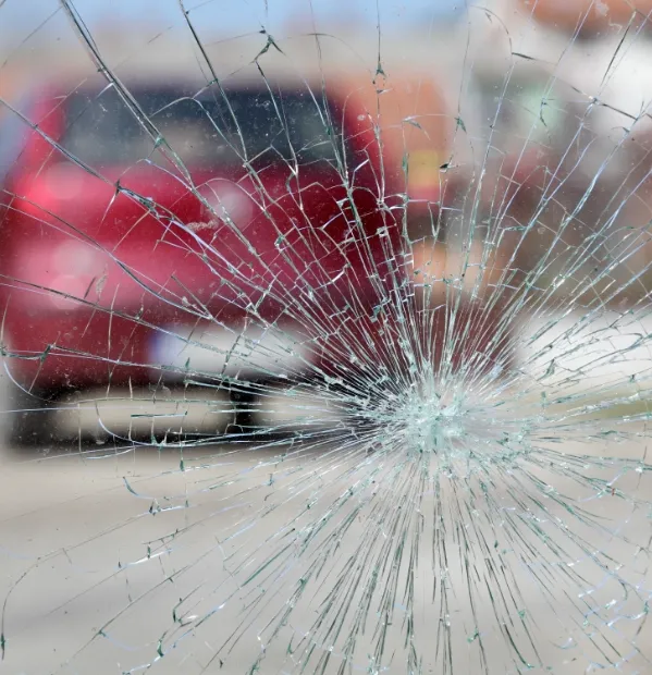 Cracked windshield after a car accident. If you've been injured in a car accident, contact our college station car accident lawyers today.