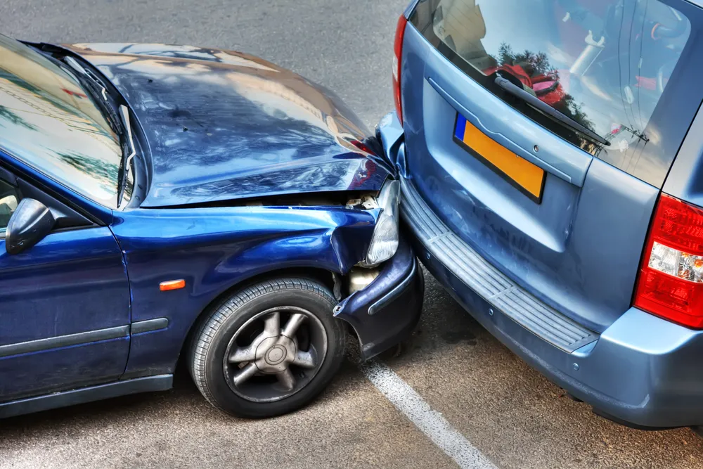 A car that has ear-ended a van. If you have been in a motor vehicle accident that is not your fault, contact a car accident lawyer in College Station as soon as possible to get the compensation you deserve.