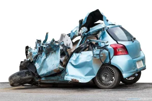 A crumpled car that has been totaled in an accident. This driver should be looking for the best car accident lawyer for their case.